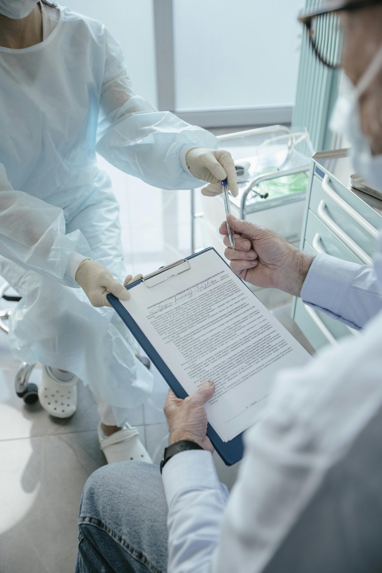 Patient signing hospital documents for admission guidance