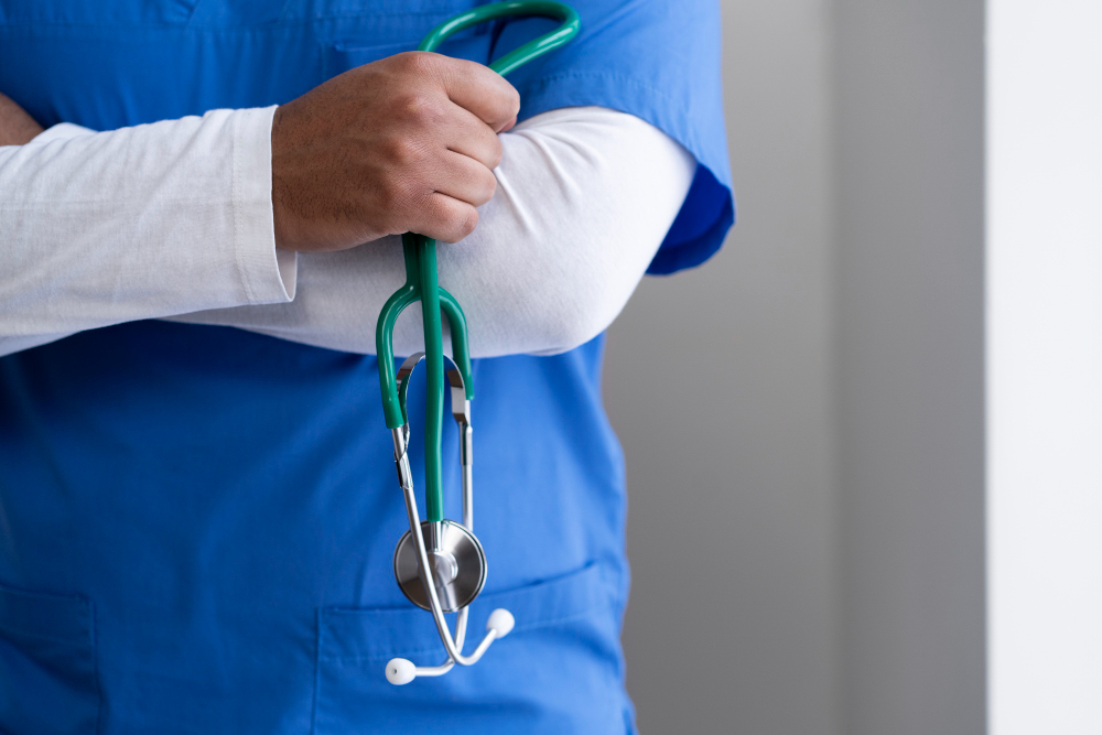 Doctor attending patient in hospital room